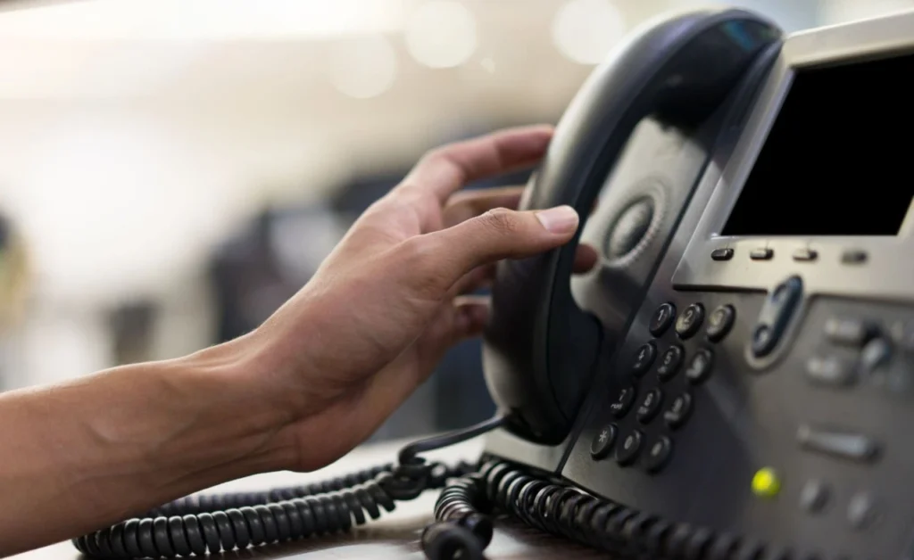 hand picking ip phone.webp